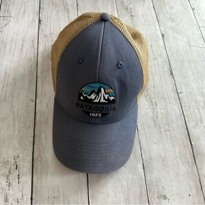 PREOWNED MENS PATGONIA NAVY BLUE BROWN LOGO HAT ADJUSTABLE